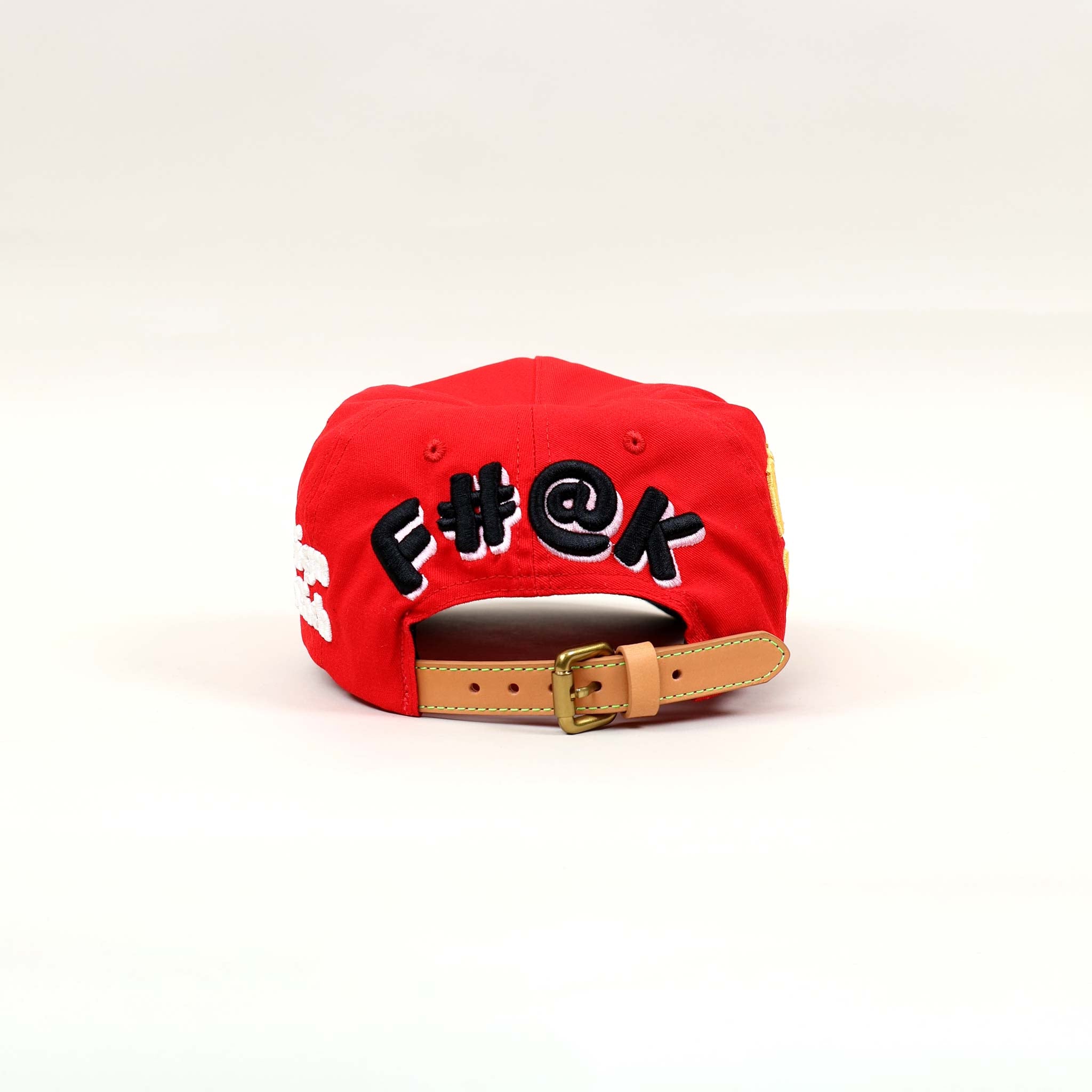 Red cap with embroidered text on the back.
