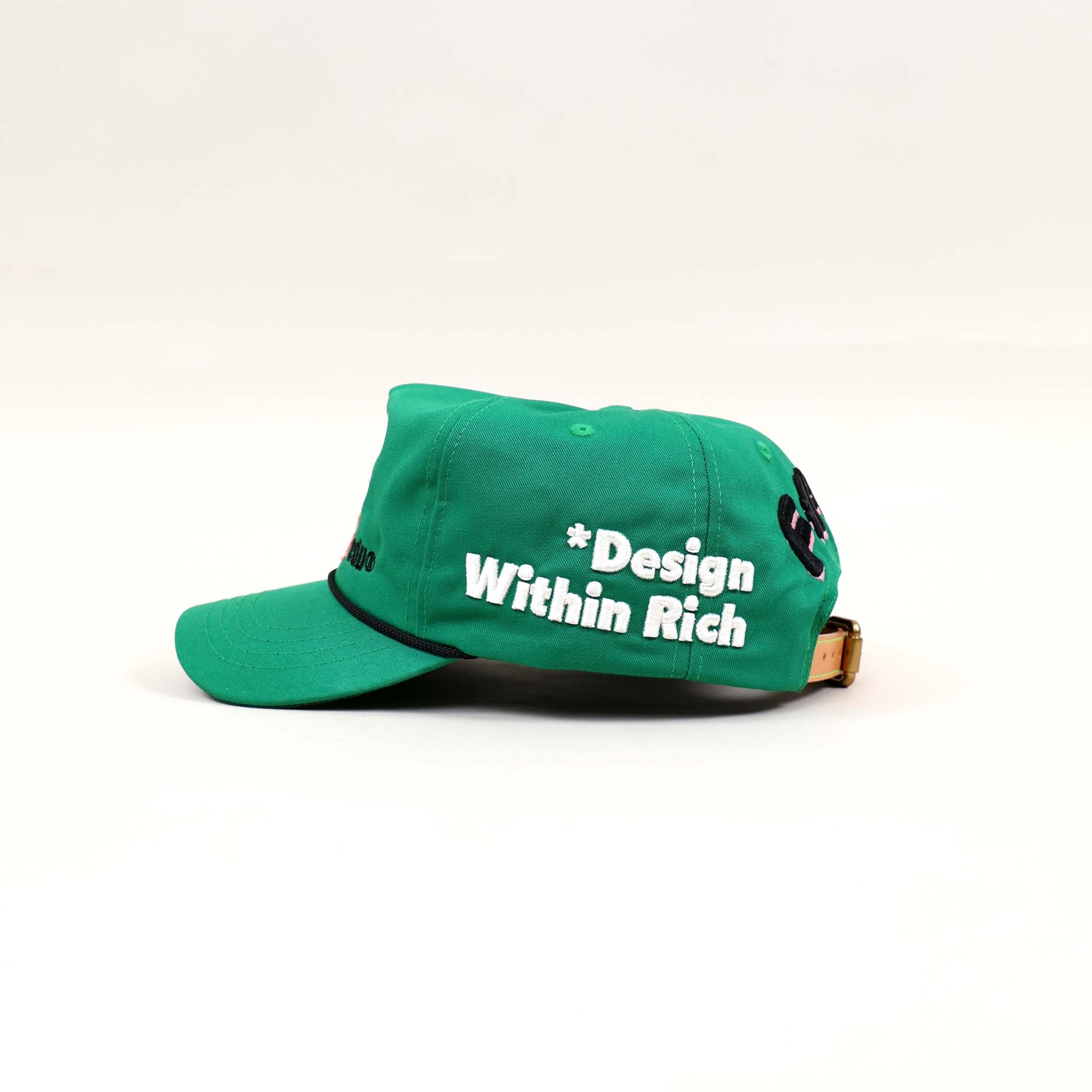 Green cap with "Design Within Rich" text.