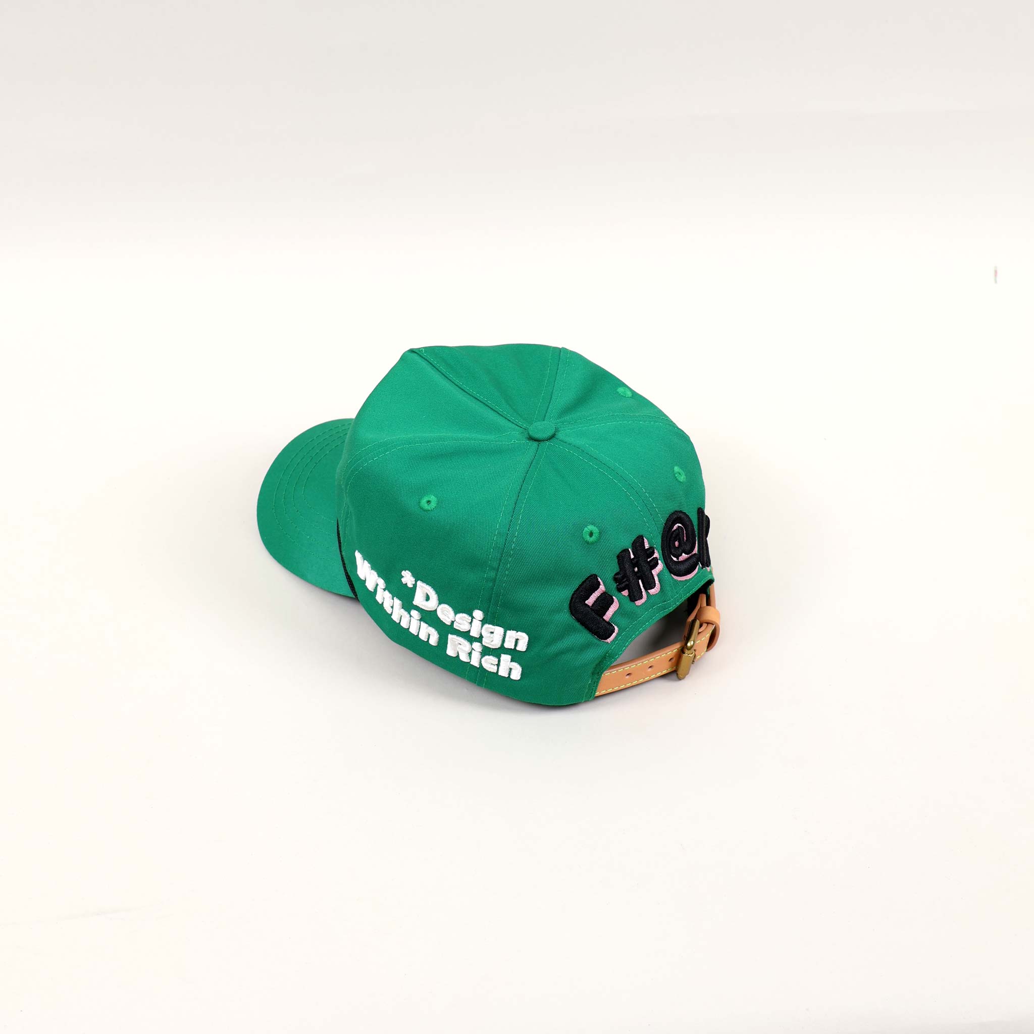 Green cap with text on the back.