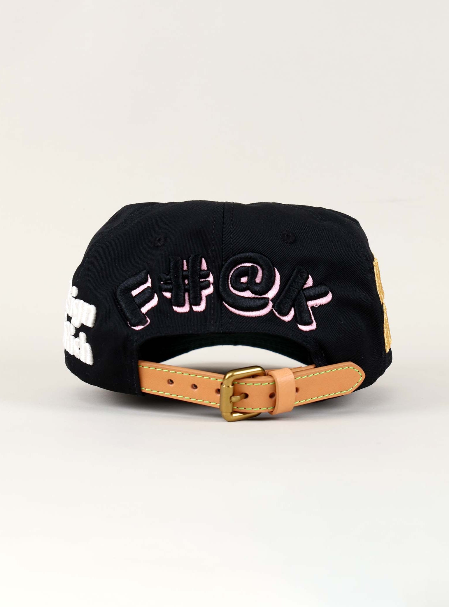 Black cap with embroidered text on the back.