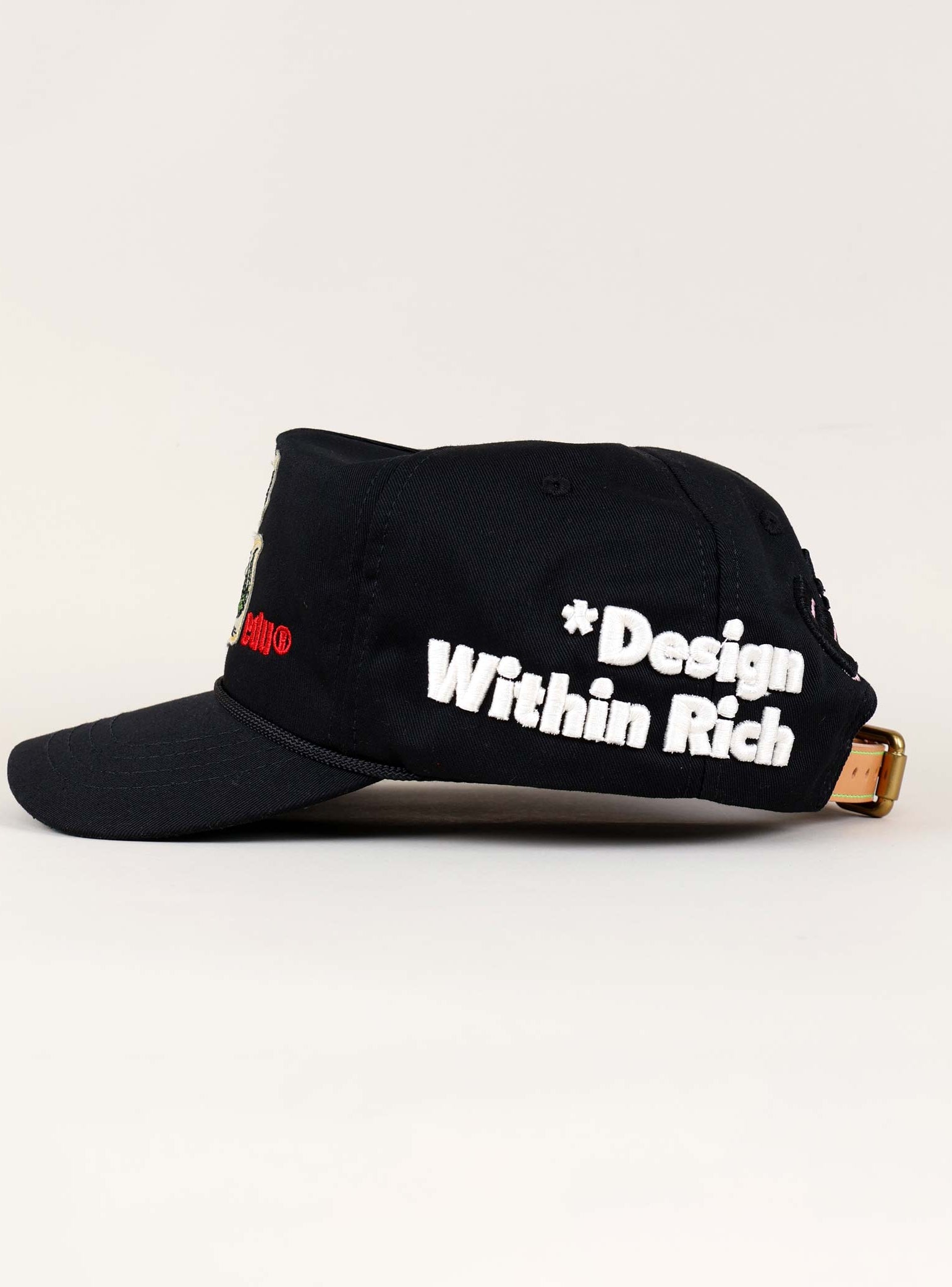 Black cap with "Design Within Rich" text.