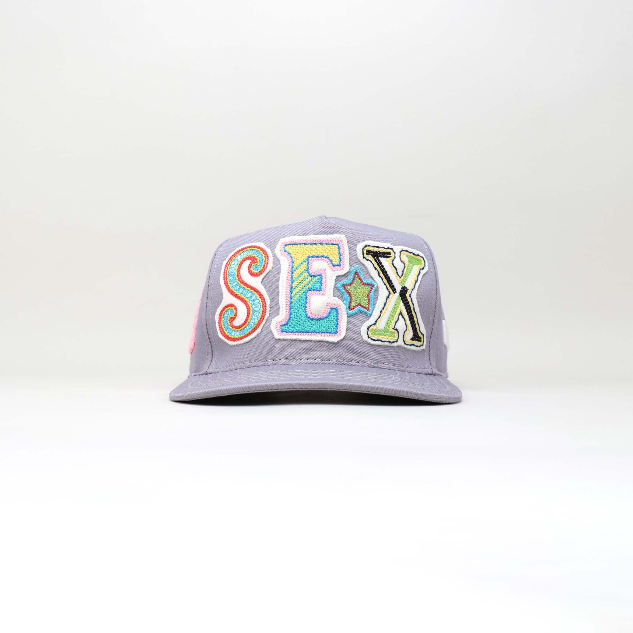 Trucker hat with "SEX" embroidery.