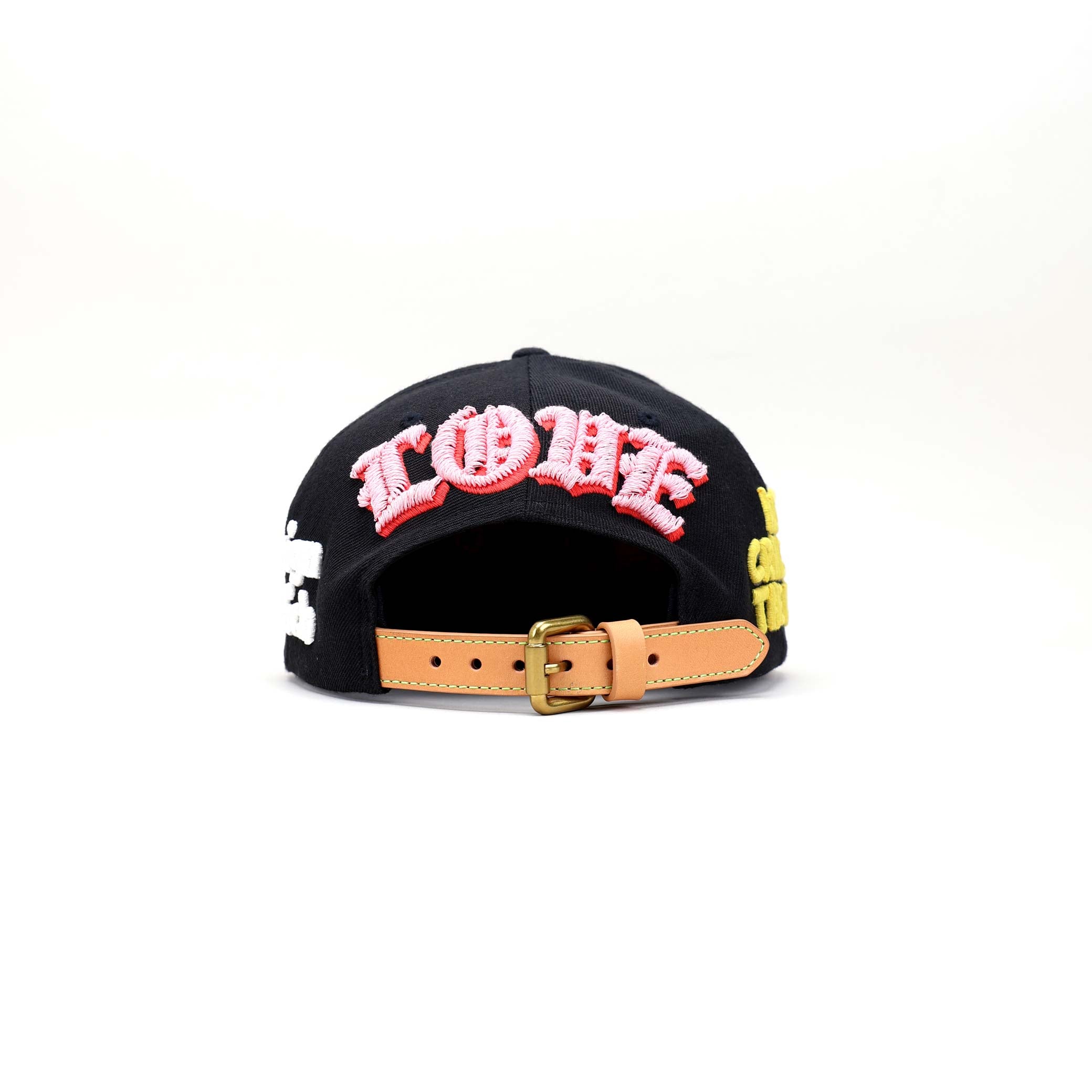 Black cap with flat bill, colorful designs, and text.