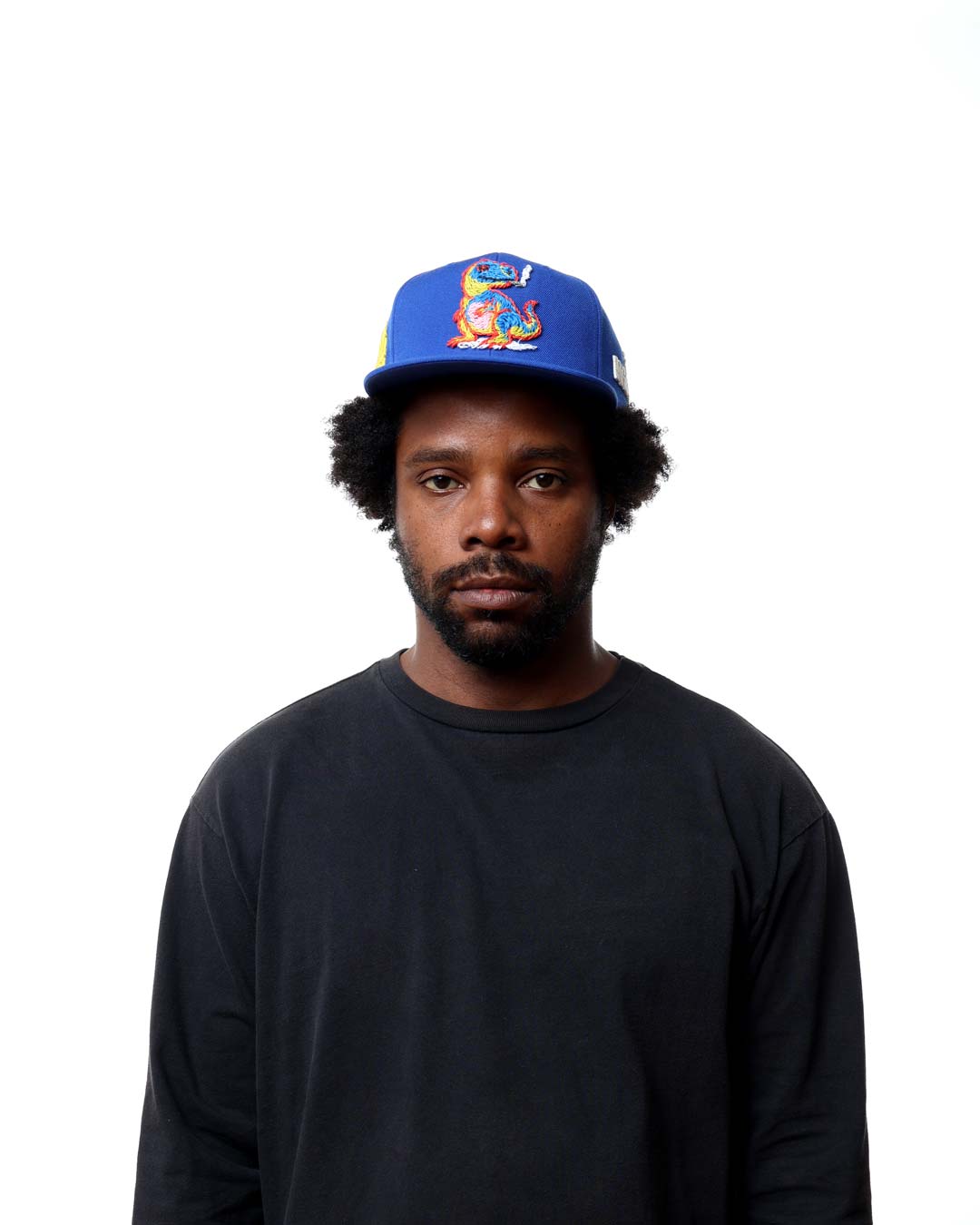 Person wearing a blue cap with a logo on a white background
