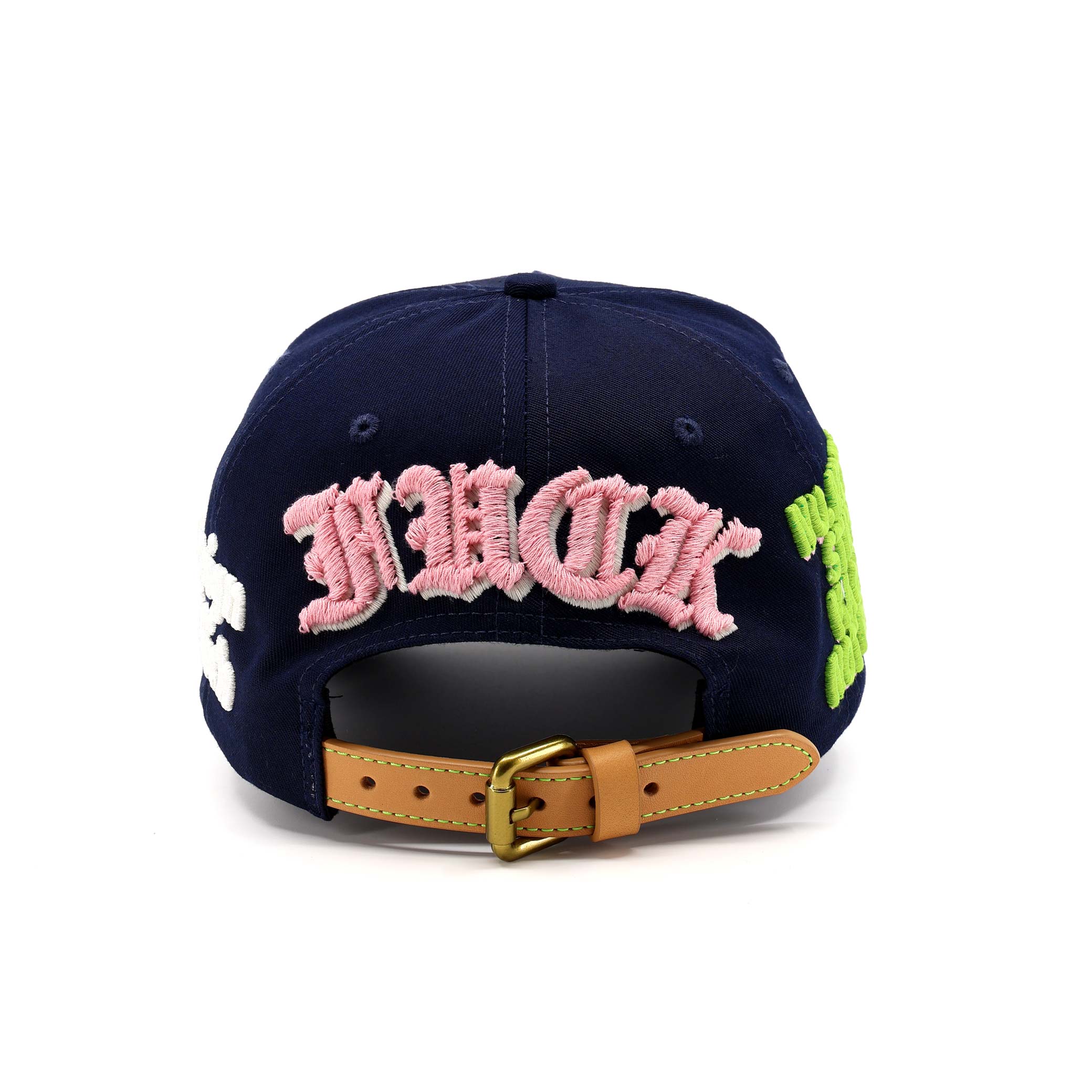 Navy blue cap with pink text and green accents on a white background