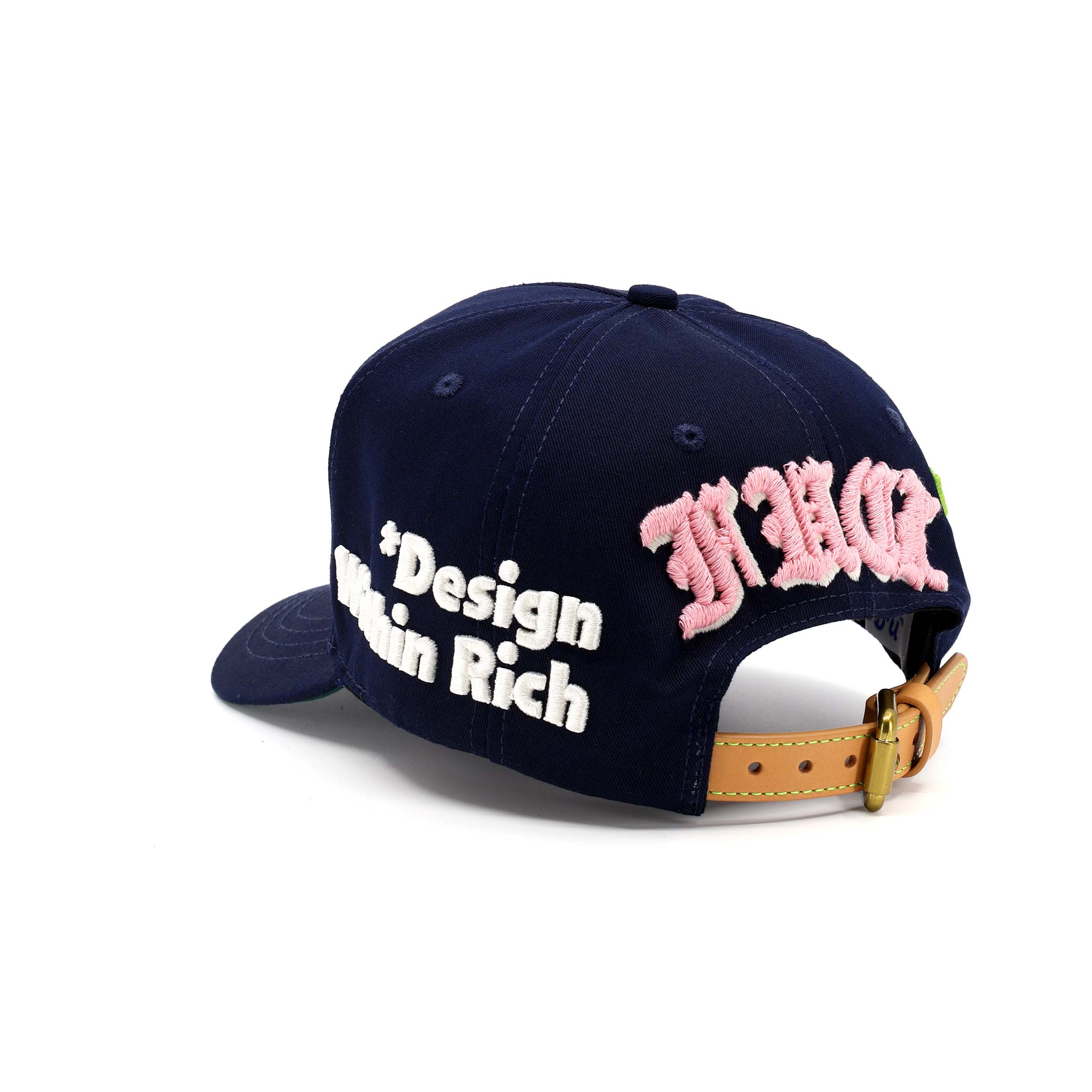 Navy blue cap with pink and white text on a white background