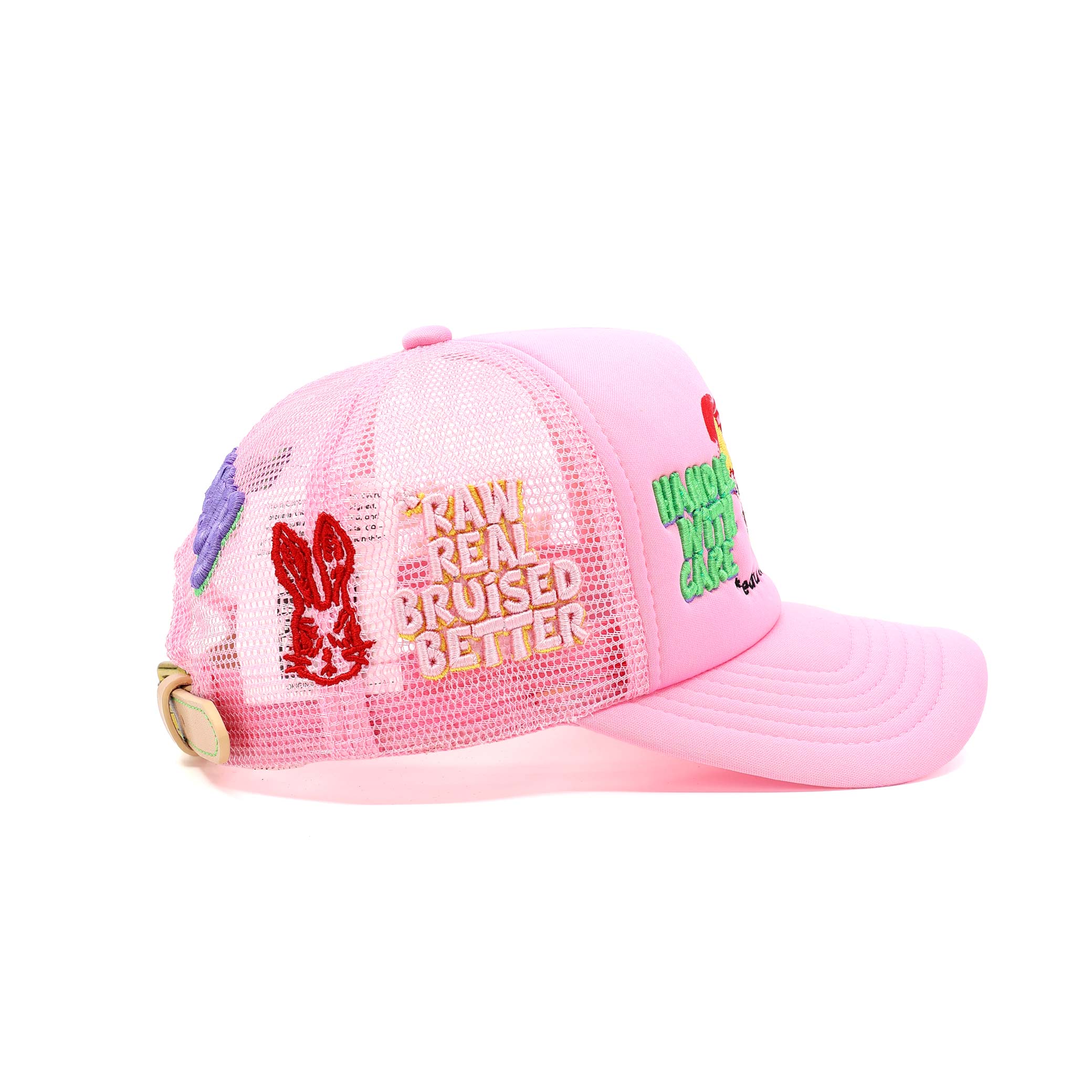 Pink cap with colorful text and graphics on a white background