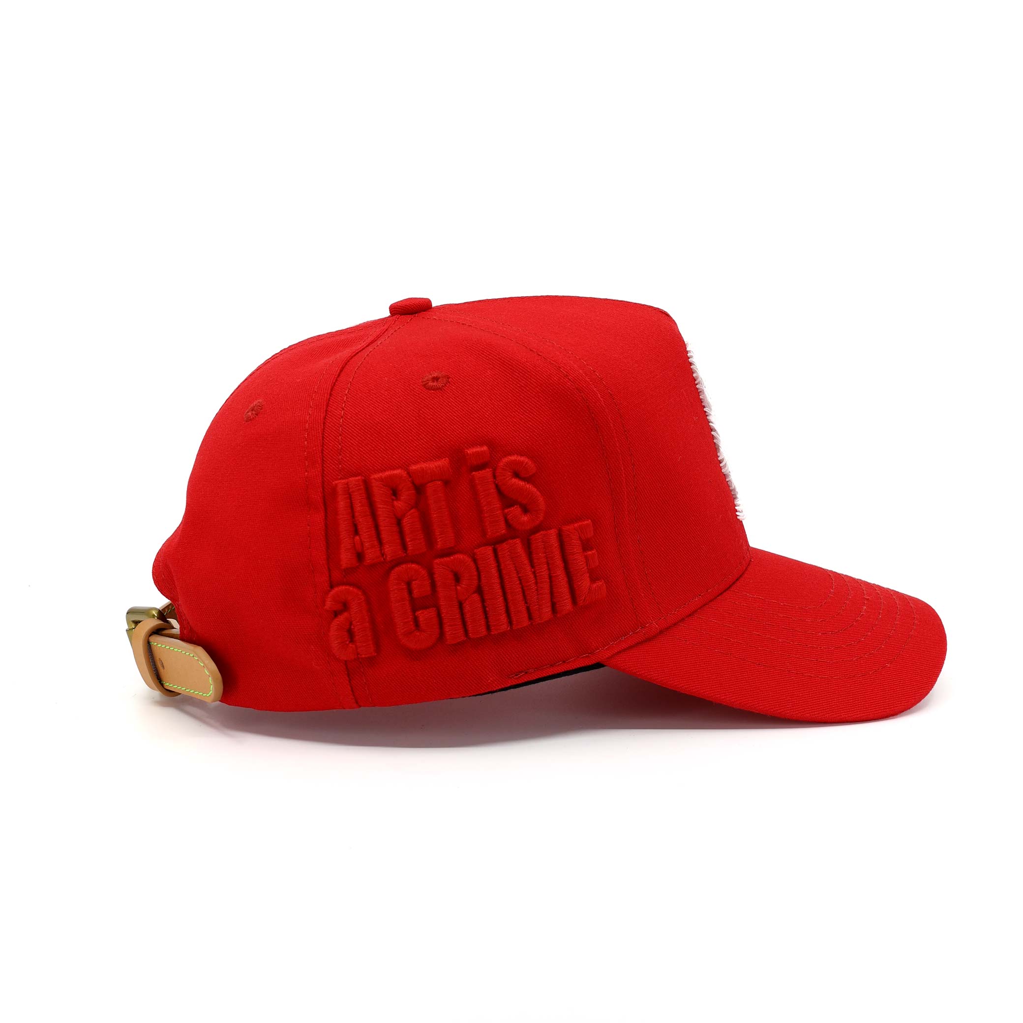 Red cap with 'Art is a Crime' text on a white background
