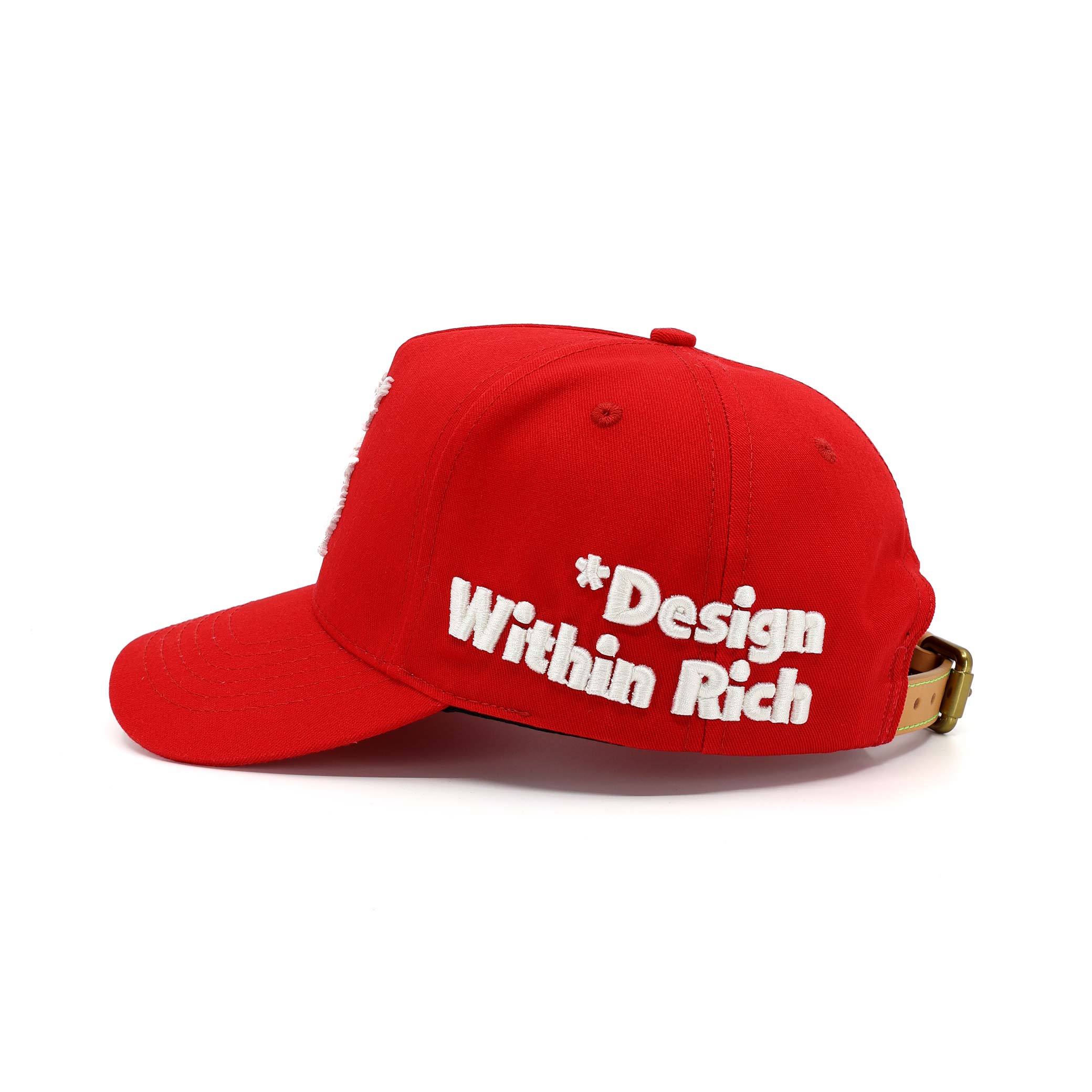 Red cap with 'Design Within Rich' text on a white background