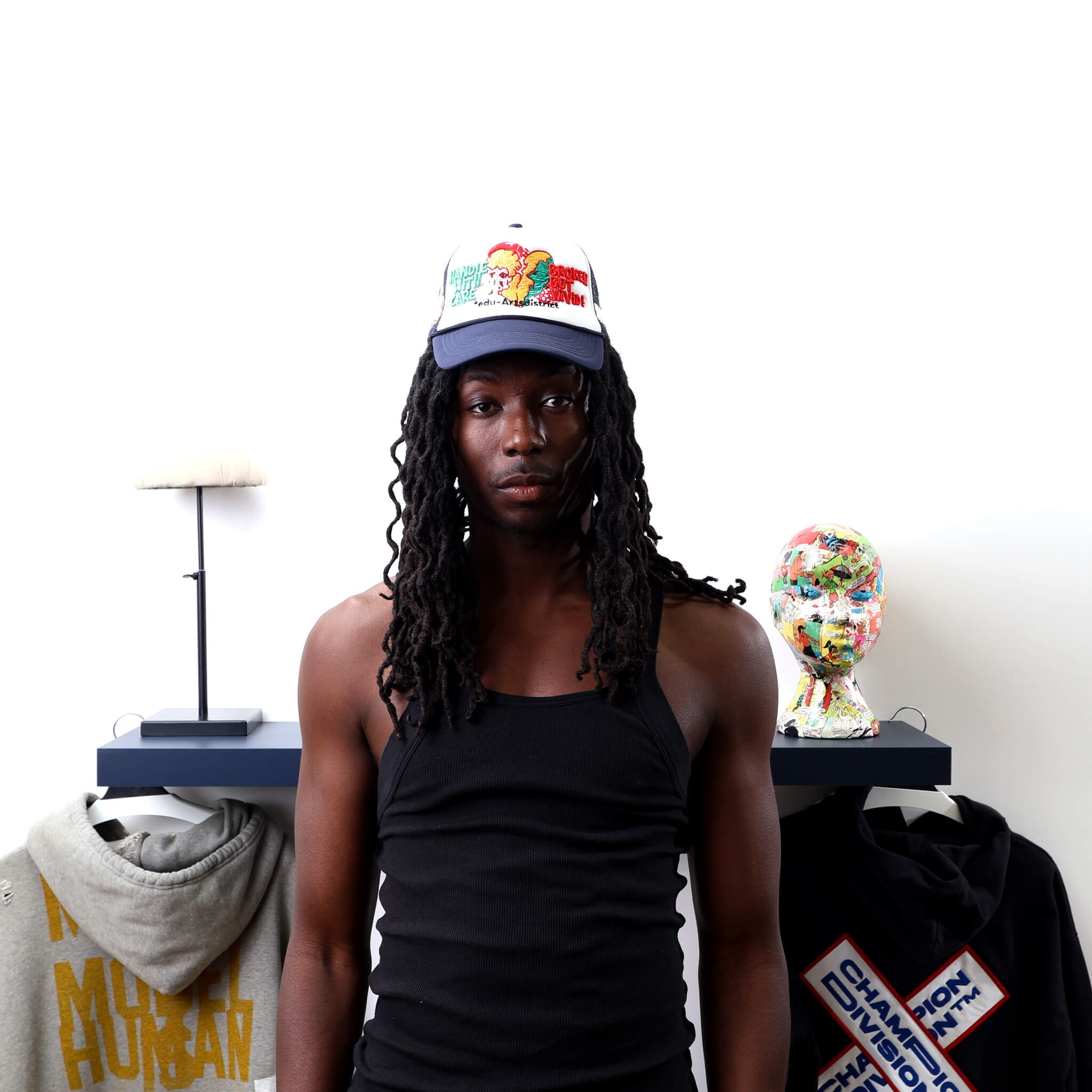 Broken Black Trucker Hat worn by male model -Front View