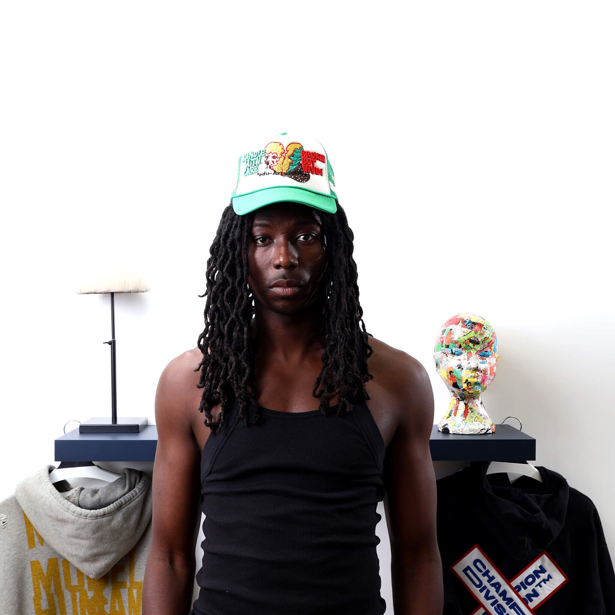 Broken Green Trucker Hat worn by male model -Front View