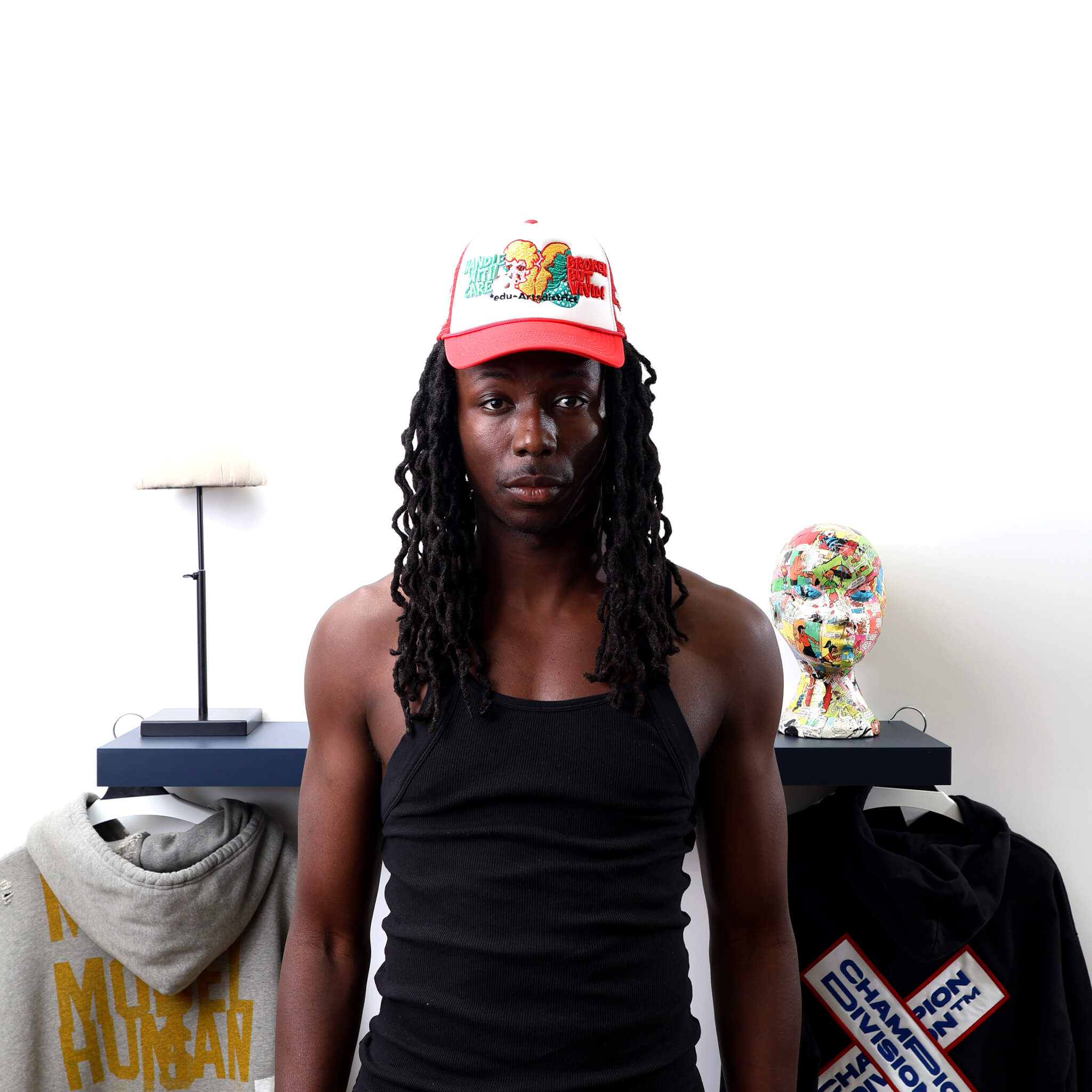Broken Red Trucker Hat worn by male model -Front View