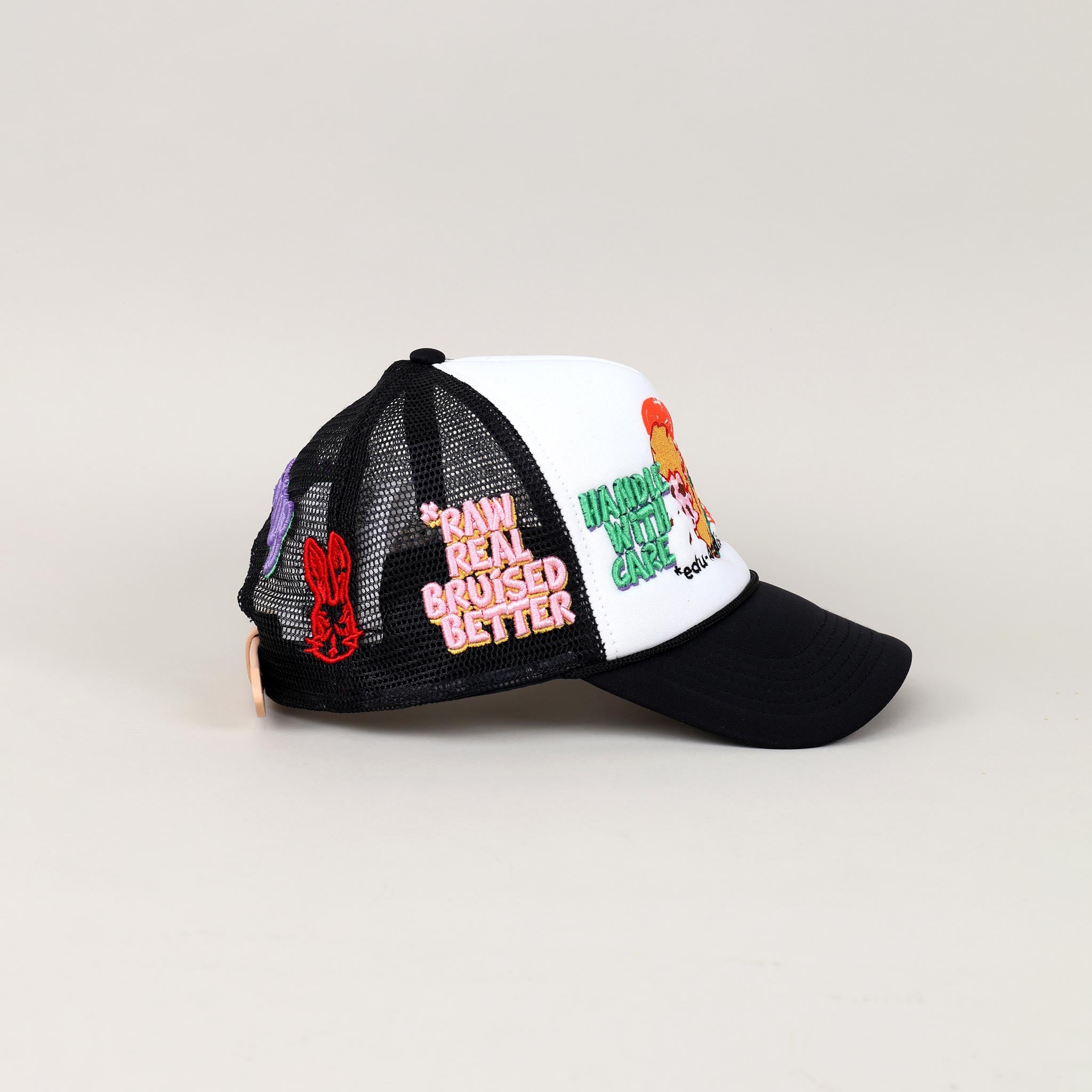 Black and white cap with embroidered patches.