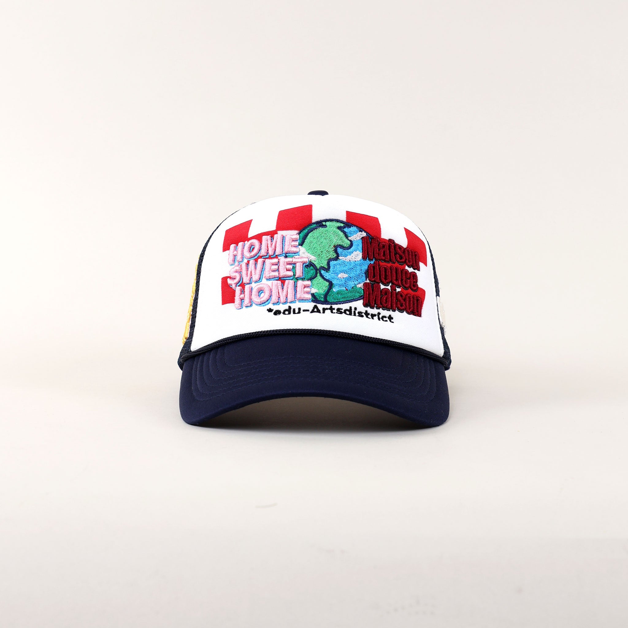 Trucker hat with "Home Sweet Home" embroidery.
