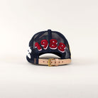 Back of a cap with "1988" embroidery.