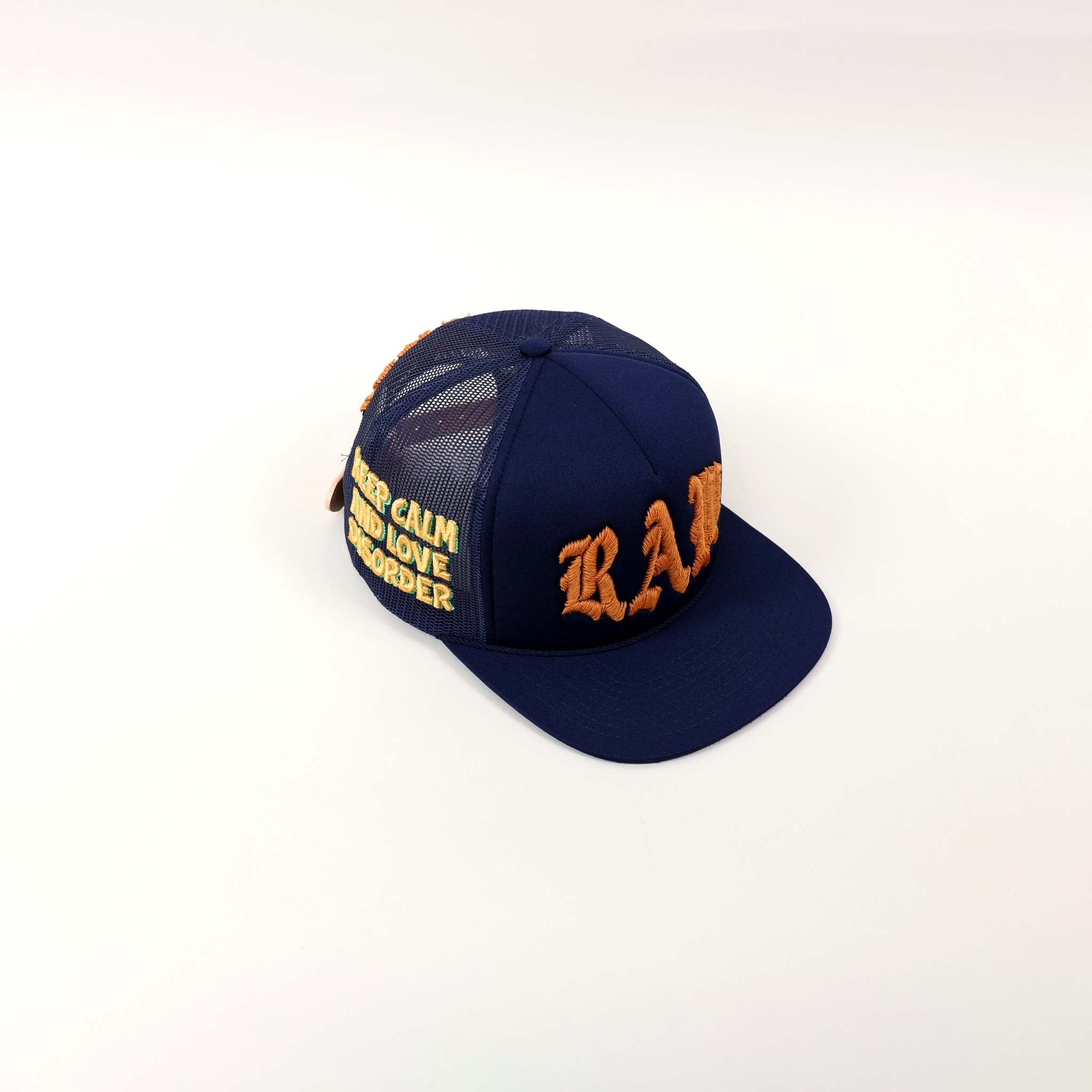 Blue cap with orange embroidered text.