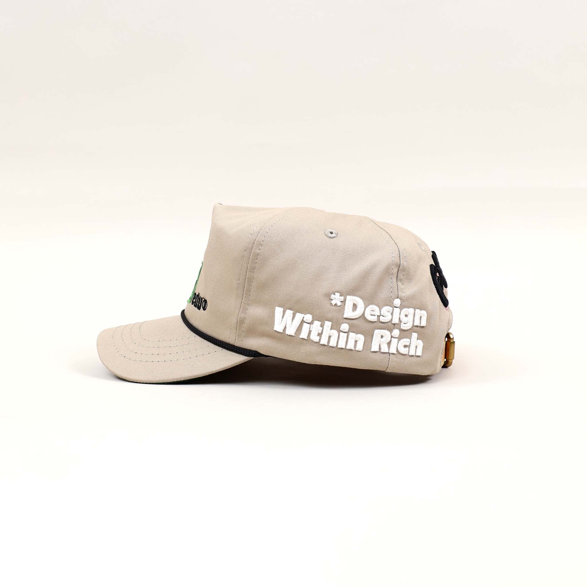 Beige cap with embroidered text.