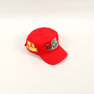 Red cap with "Art is a Crime" text.