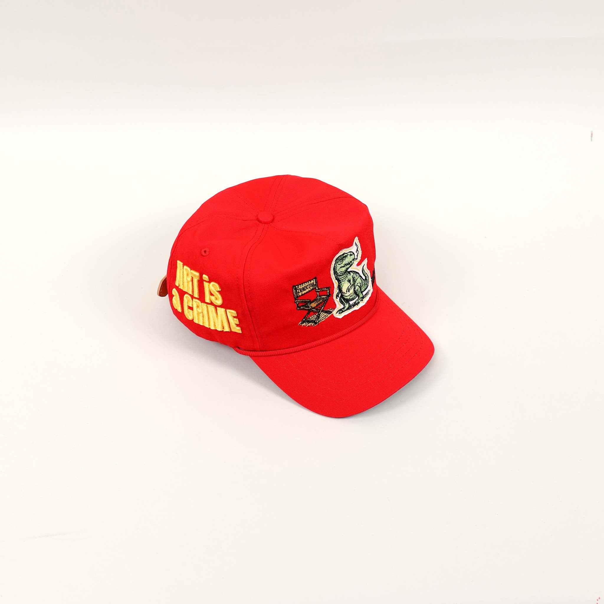 Red cap with "Art is a Crime" text.
