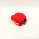 Red cap with embroidered text on the back.