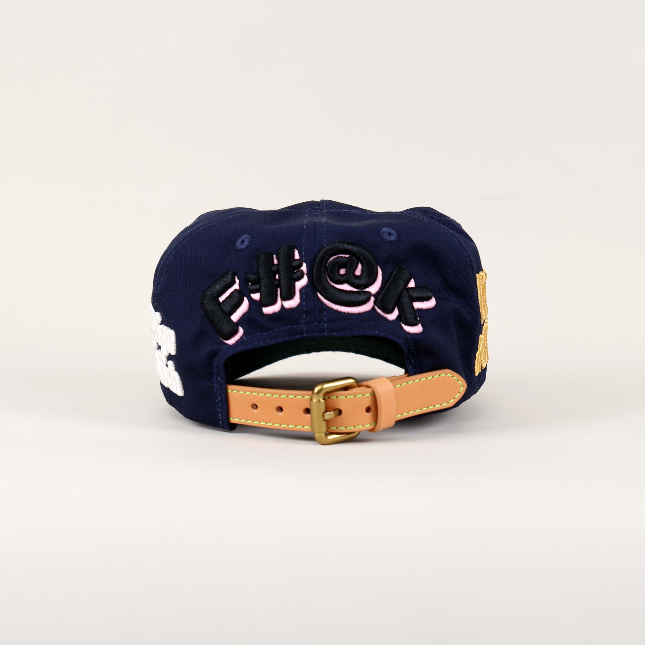 Navy cap with embroidered text on the back.