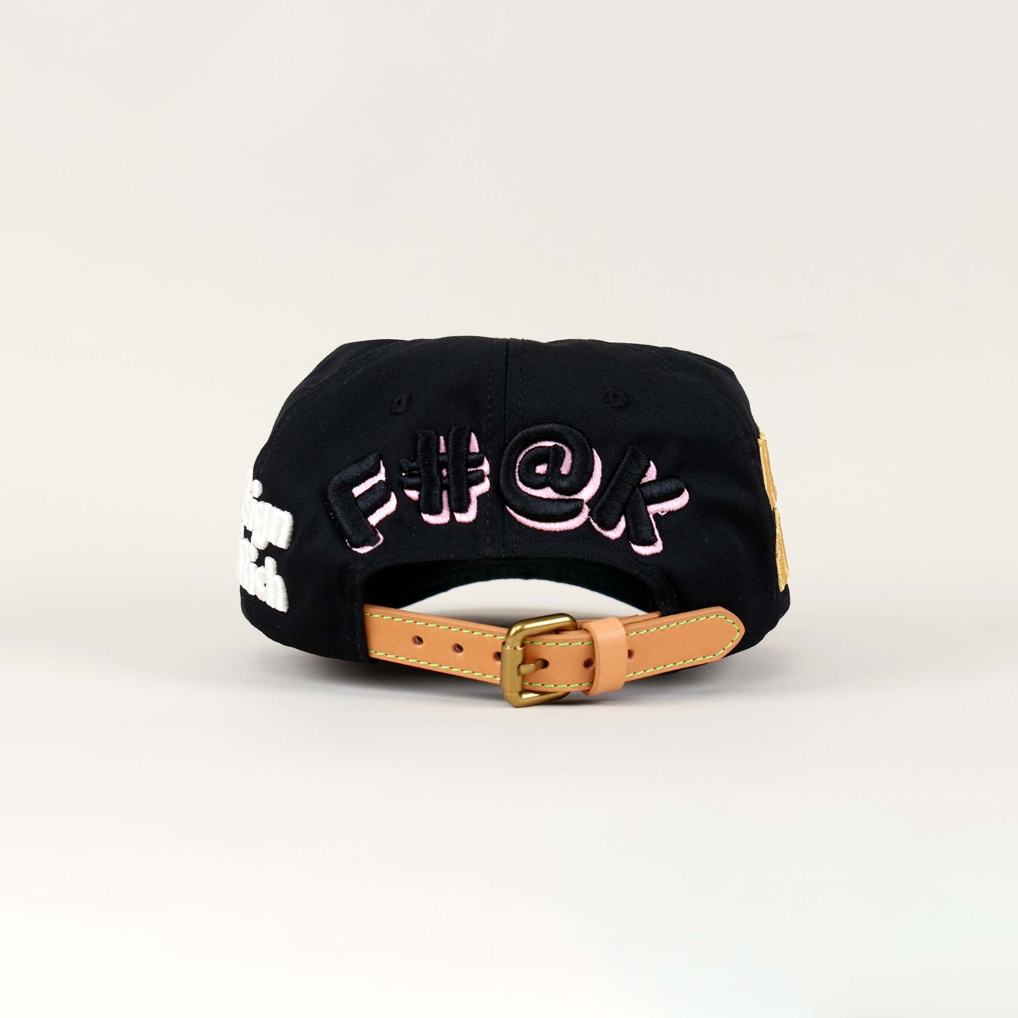 Black cap with embroidered text on the back.
