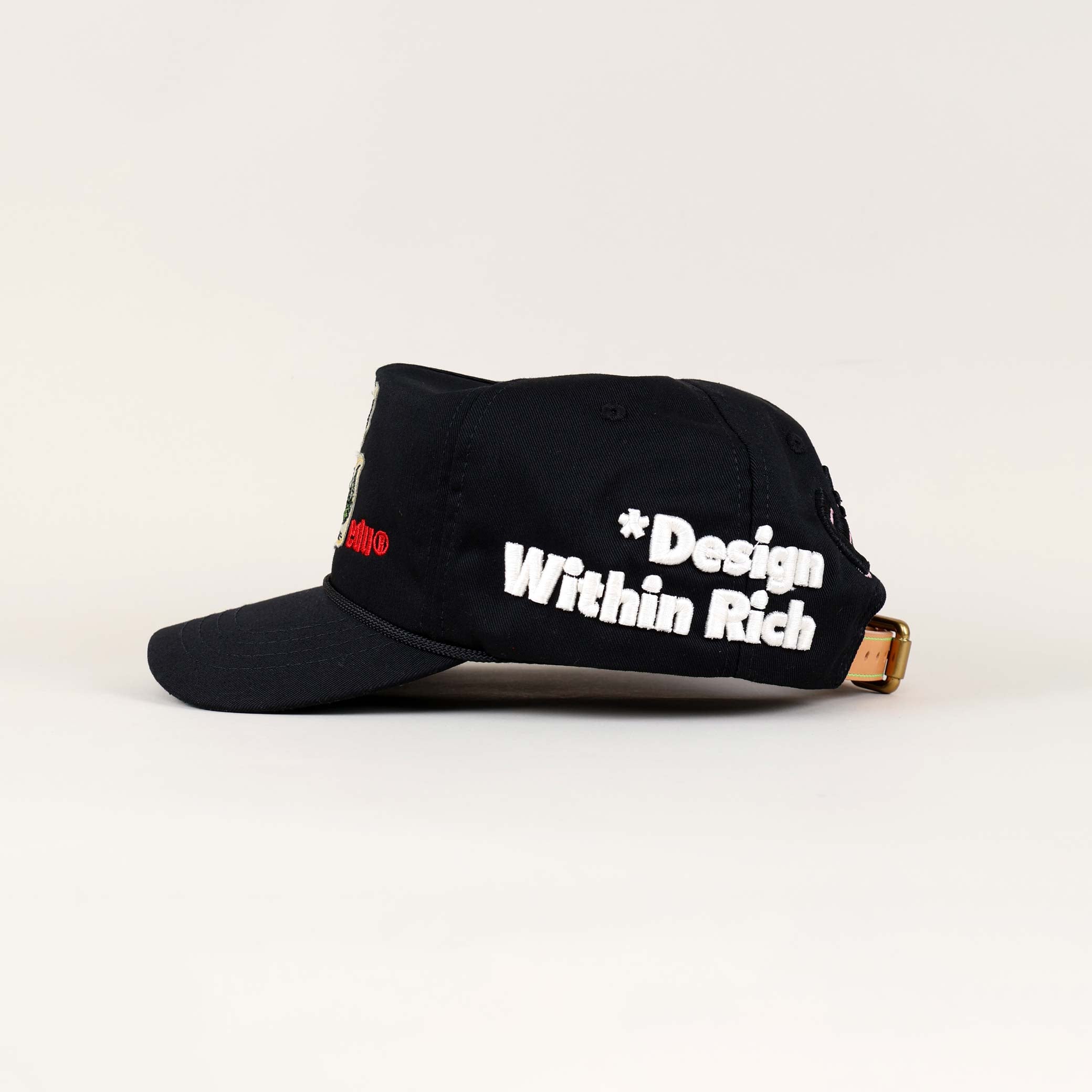 Black cap with "Design Within Rich" text.