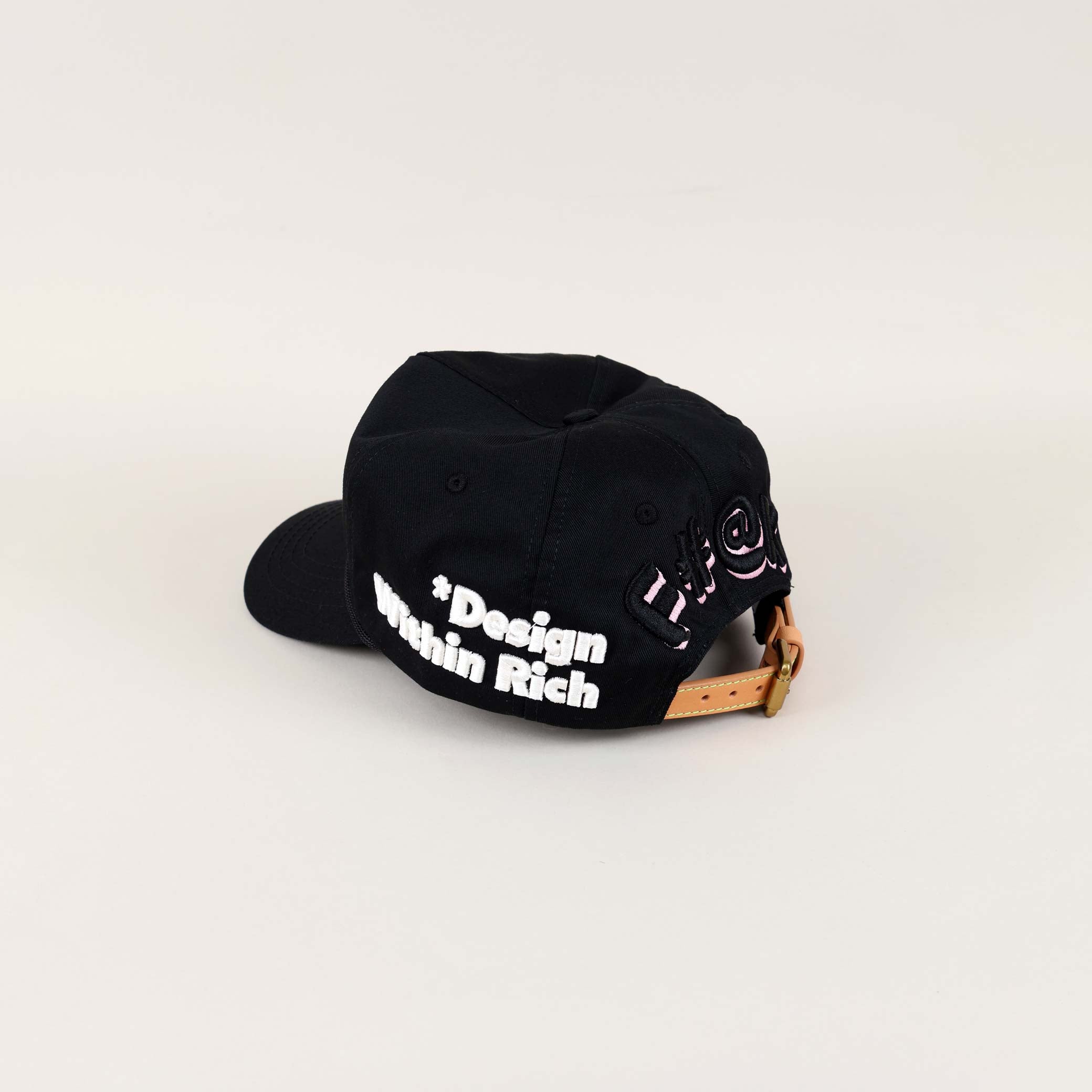 Black cap with "Design Within Reach" text.