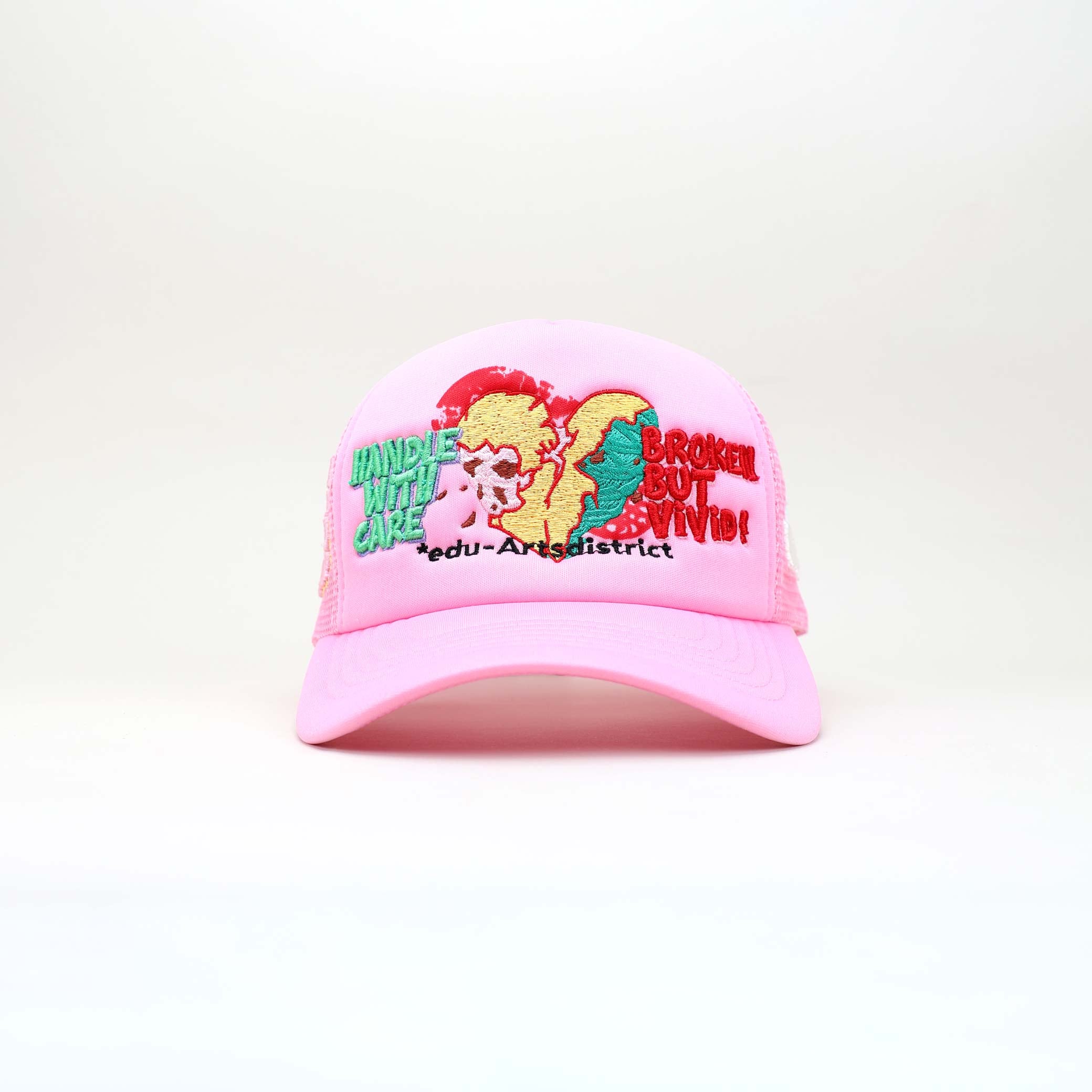 Pink mesh cap with colorful graphic, text, and leather strap