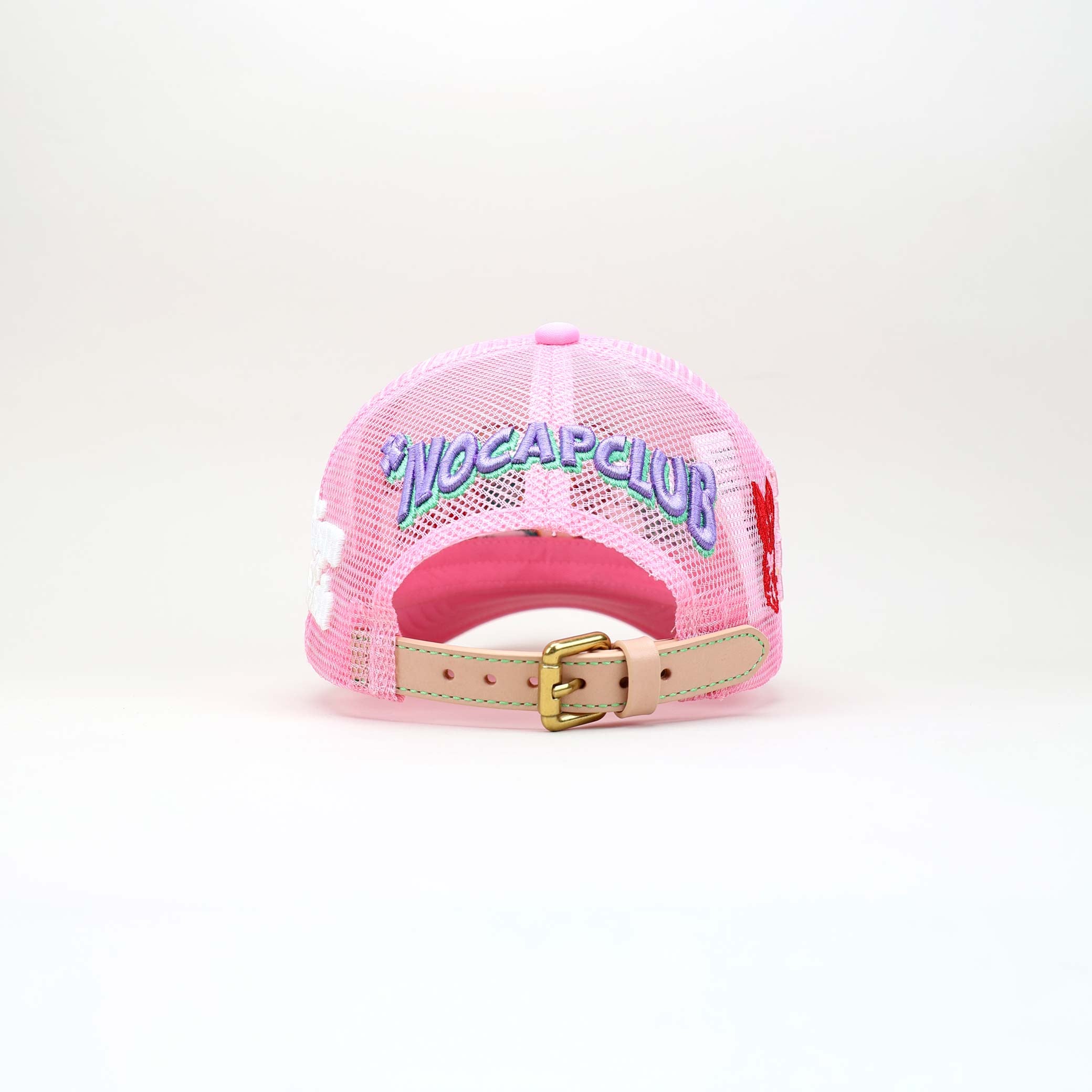 Pink mesh cap with colorful graphic, text, and leather strap