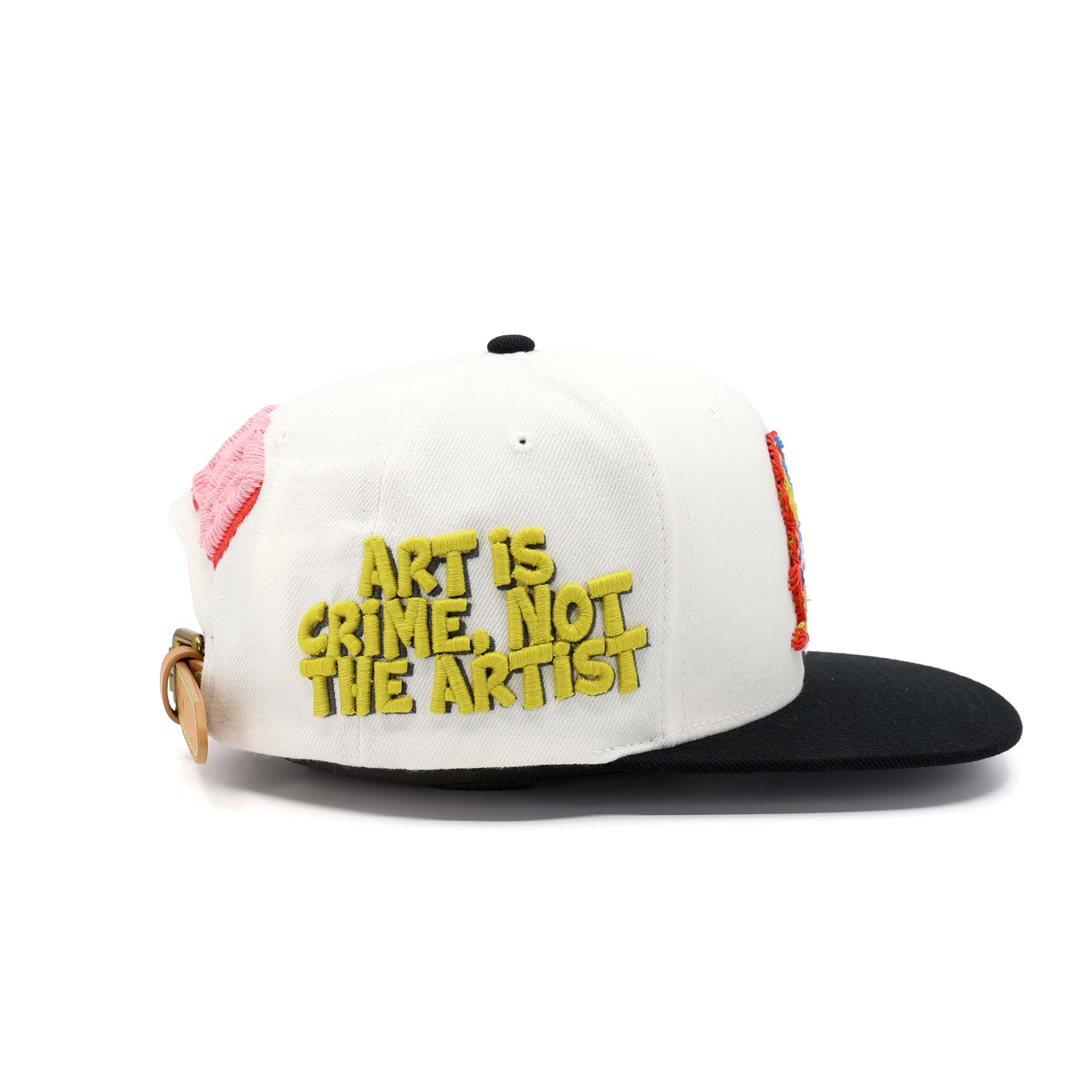 Cap with 'Art is Crime, Not the Artist' text on a white background