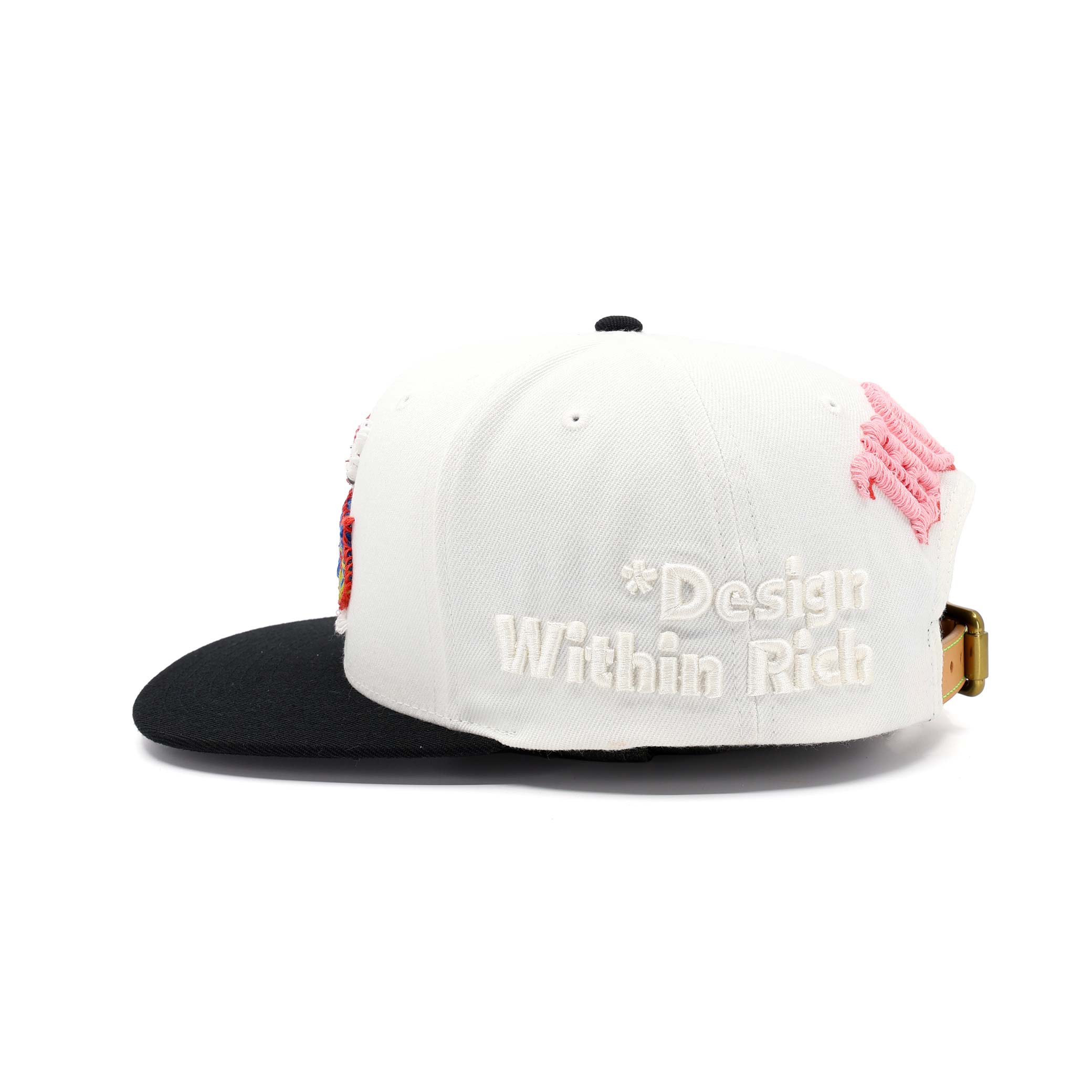 White and black cap with pink accents and 'Design Within Rich' branding on a white background