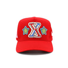 Red cap with colorful 'X' and star designs on a white background