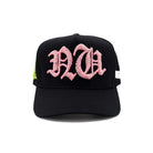 Black cap with pink logo on a white background