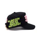Black cap with colorful text and pink accents on a white background