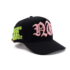 Black cap with pink and green text on a white background