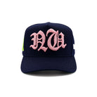 Navy blue cap with pink 'RCA' embroidery on a white background