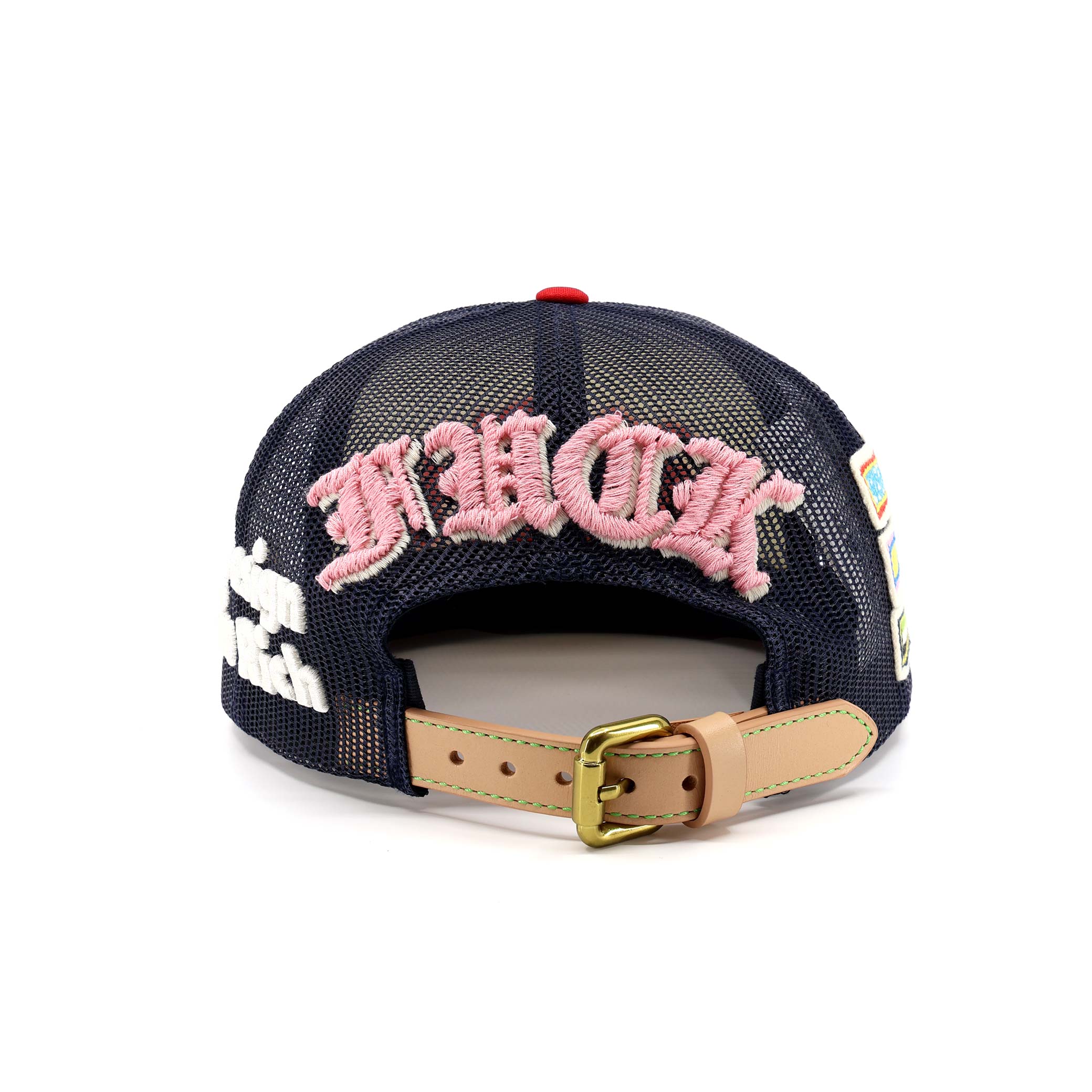Navy blue cap with pink text and a tan strap on a white background