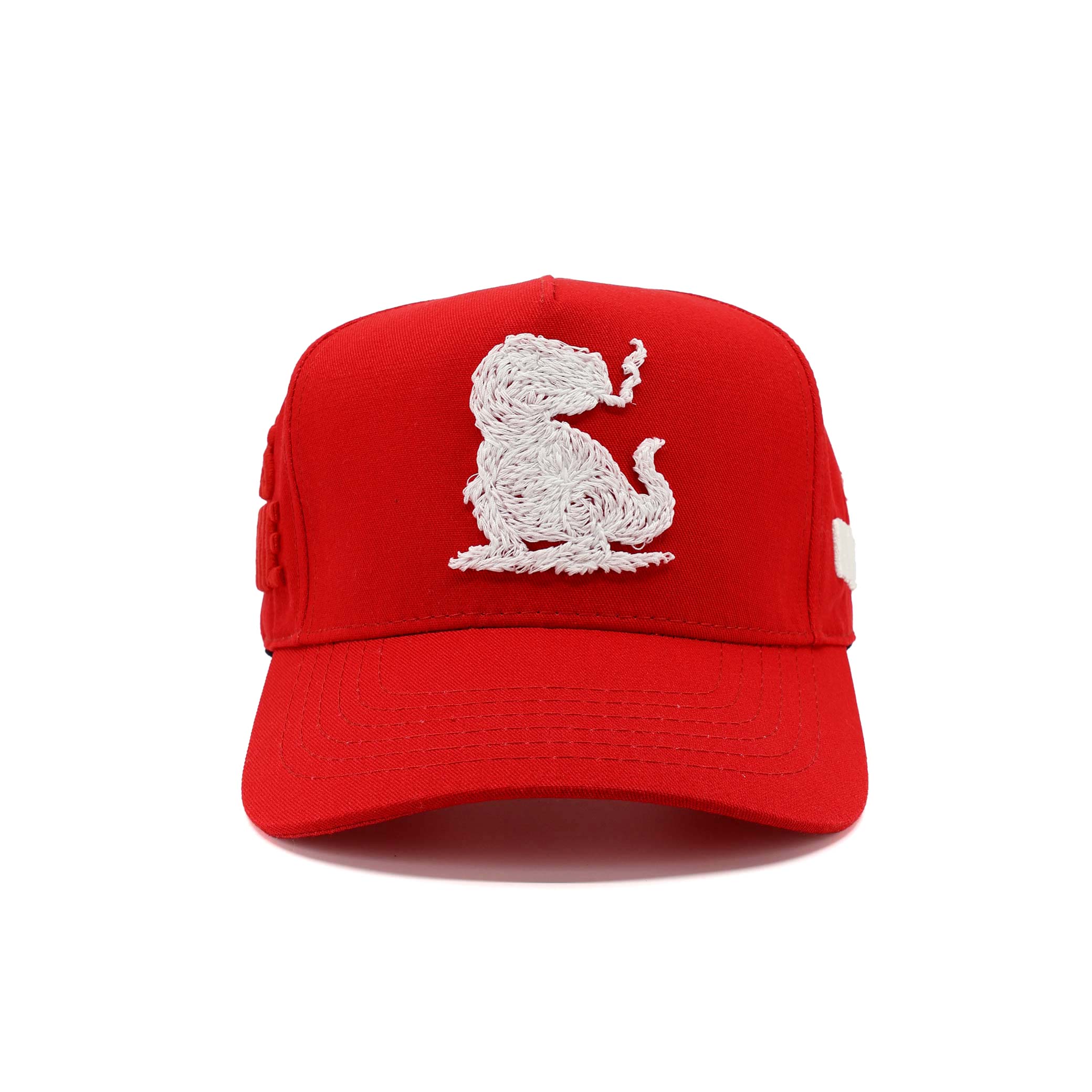 Red cap with white embroidered design on a white background