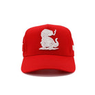 Red cap with white embroidered design on a white background