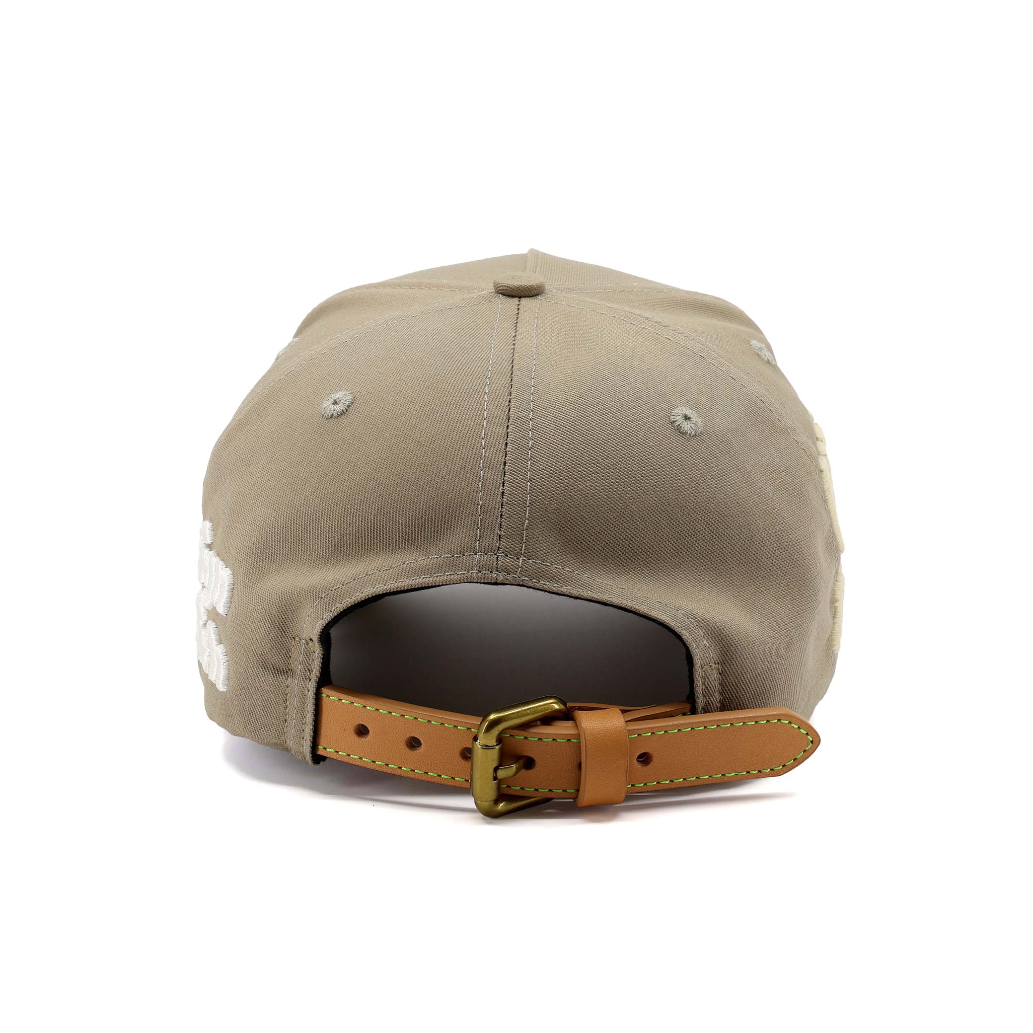 Beige cap with brown leather strap on a white background