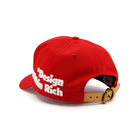 Red cap with 'Design Rich' text on a white background