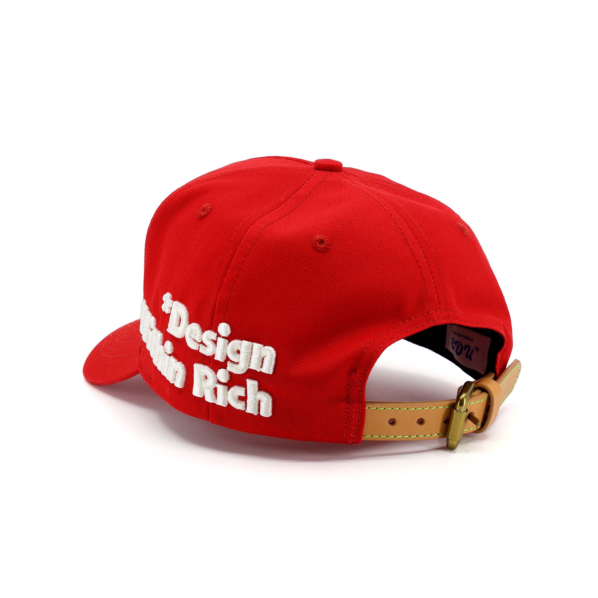 Red cap with 'Design Rich' text on a white background