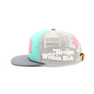 Trucker hat with turquoise front panel, gray bill, and white mesh back on a white background